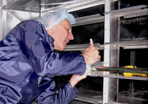 Gil inspecting air duct